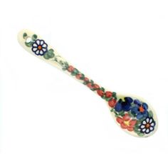 a ceramic spoon with flowers painted on it