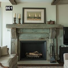 a living room with a fire place in the center and a painting on the wall