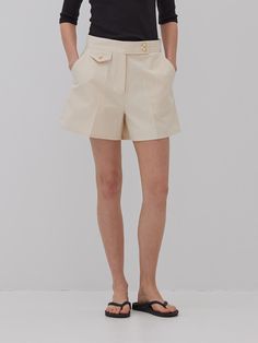 This is a feminine and modern pants by MangoManyPlease that is made out of high quality and sturdy material. With distinctive mood of the design and comfortable wear, you can style it for your feminine daily outfit.- Relaxed A line silhouette- Subtle gold button on high density fabric- Trendy and feminine mood Elegant Shorts With Buttons, Elegant High-waisted Shorts With Pockets, Elegant High-waisted Shorts With Button Closure, Elegant High Waist Shorts With Button Closure, Elegant Short Bottoms With Button Closure, Elegant Wide Leg Beige Shorts, Elegant Short Pants With Pockets, Chic Beige Shorts For Workwear, Chic Beige Shorts For Work