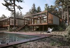 an image of a house in the woods with a swimming pool and stairs leading up to it