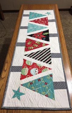 a table runner made out of strips of fabric