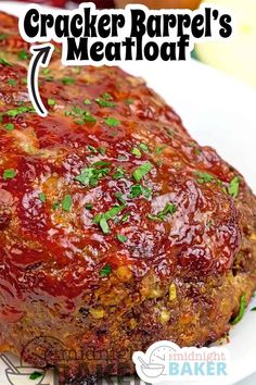 a meatloaf on a white plate with the words cracker barrel's meatloaf above it