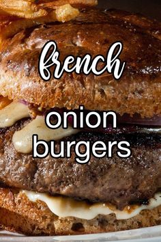 a close up of a burger on a plate with french fries