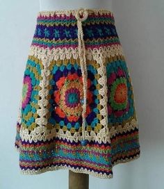 a crocheted skirt is displayed on a mannequin