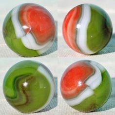 four marbles with different colors and designs on them