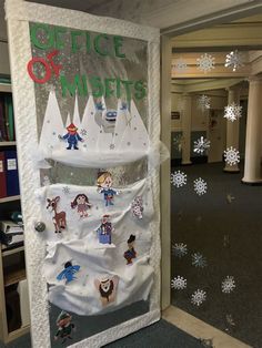 an office door decorated with snowflakes and magnets for the holiday decorations on display