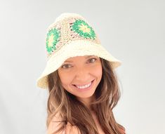 A straw bucket hat for women is a stylish and functional accessory that provides sun protection while adding a touch of fashion to any outfit. It is made from natural straw materials and features a wide brim to shield the face and neck from harmful UV rays. The hat's bucket shape provides excellent coverage and allows for easy wear, while the straw construction provides durability and breathability for maximum comfort. Perfect for summer outings, beach trips, and outdoor events, a straw bucket h Handmade Beige Cloche Hat For Spring, Handmade Sun Hats For Spring, Bohemian Mini Bucket Hat For Summer, Bohemian Style Mini Bucket Hat For Summer, Summer Bohemian Mini Bucket Hat, Adjustable Cream Crochet Hat For Spring, Green Mini Hats For Beach, One Size, Handmade Mini Hats For Vacation In Spring, Green Brimmed Mini Hat For Beach