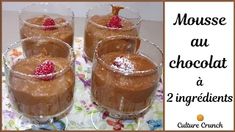 three glasses filled with chocolate pudding and topped with raspberries