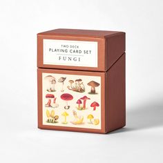 two deck playing card set with mushrooms and toades in brown box on white background