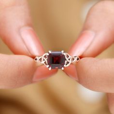 Product Details Embrace yourself with the captivating beauty of this Solitaire Ring adorned with an 8 MM Asscher Cut Garnet gemstone and Celtic Design. Product Information SKU SHP-RINGS0821135750 Width 7 mm Height 5 mm Weight 2.48 gm (Approximate) GARNET INFORMATION No.of Stones 1 Pieces Total Weight 3.30 Carat (Approximate) Dimension(approx) Asscher-8X8 mm-1 Pcs Color Red Cut Brilliant Shape Asscher Setting Type Other-Setting Quality Grade AAA View More Product Parent Collection Handle garnet-rings Embrace Yourself, Celtic Ring, Celtic Design, Celtic Rings, Asscher Cut, Signature Jewelry, 18k Yellow Gold Ring, Celtic Designs, Timeless Jewelry