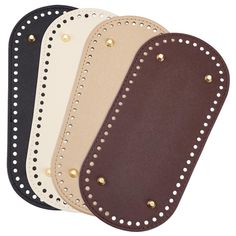 four pairs of leather pads with gold studs on the sides and one in black, white