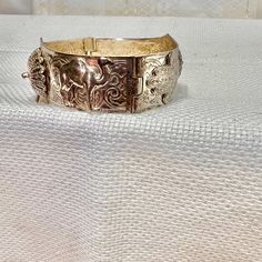 Please be sure to inspect pictures and descriptions carefully as I do not accept returns, exchanges or cancellations **Please be sure to review all photos** Vintage Camel bracelet. Estate piece. Pre-owned. Has some patina. Hinge pin bracelet. Approximately 7.25 inch and 1 inch wide. Costume jewelry.  Poilishing cloth included.  It is possible that it is sterling silver as I see most are but there are not markings.  ---CONDITION Has some mile petina.  All jewelry should be cleaned and sanitized before you wear them. All are vintage and most have been worn at least once. Some may have minor flaws and patina, show some wear, need to be polished and cleaned.   All major flaws, chips, cracks and wearing of paint will be noted in the pictures and/or descriptions. Vintage and Antique items will h Ornate Adjustable Cuff Bracelet For Formal Occasions, Antique Adjustable Jubilee Bracelet, Elegant Festival Jewelry With Bracelet Strap, Unique Ceremonial Sterling Silver Bangle Bracelet, Unique Sterling Silver Bangle Bracelet For Ceremonial Occasions, Unique Sterling Silver Bangle For Ceremonial Occasions, Unique Engraved Bangle For Formal Occasions, Adjustable Ornate Bangle For Formal Occasions, Adjustable Hinged Bracelet Jewelry