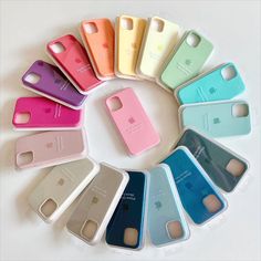 the iphone cases are arranged in a circle on top of each other, all different colors