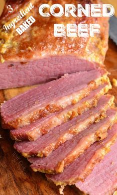 sliced meat sitting on top of a wooden cutting board