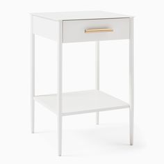 a white table with a gold drawer on the top and bottom shelf, against a white background