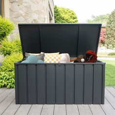 an outdoor storage box with stuffed animals in it