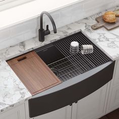 a kitchen sink with a cutting board on the counter