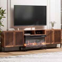 a living room with a fireplace and television on the wall, in front of a large flat screen tv