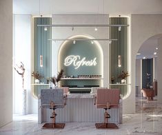 the interior of a nail salon with two chairs and a counter in front of it