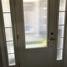 a white door with frosted glass on the front and side doors to both sides