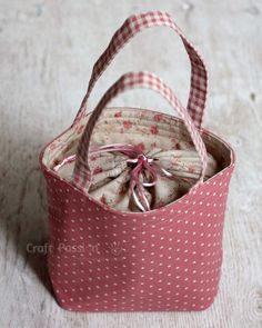 a small pink and white polka dot bag