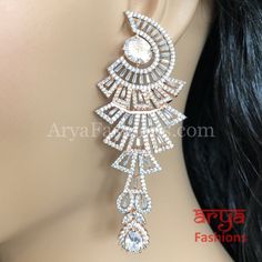 Silver and Rose Gold Cubic Zirconia Bridal Indian/ Bollywood Party earrings. Silver Cubic Zirconia Party earrings Dimensions: Approx.. 3.5 Inches Earrings come with Push back closure Made in Brass with Victorian Rose Gold finish Made with very high quality Cubic Zirconia Suitable for any occasion Bridal Party Earrings, Bridal Indian, Bollywood Party, Jewelry Drawing, Jeweled Earrings, Bollywood Jewelry, Party Earrings, Indian Bollywood, Diamond Set