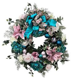 a wreath with blue, pink and white flowers