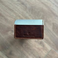 Handcrafted leather card holder, Minimalist design, Easy to use A slim leather card holder with 3 pockets in total, 1 card slots on each side and 1 central slip compartment. The Monarch Shield Products are made from full grain leather and is built to last FEATURES 7cm x 10.5cm ✔ 2 card slots ✔ 1 main compartment for cash or more cards ✔ Quality full grain leather ✔ Hand stitched with durable waxed thread - We offer FREE engraving services - Please leave us a note in the personalized box and type your engraving text  - Or at the last page of checkout, below the Submit Order button, there is a box where you can "Add an optional NOTE to the seller." Simply leave your engraving instructions there. If you do miss this step, just send us a message about your engaraving text and we will make it r Modern Brown Card Holder With Card Slots, Modern Brown Card Holder For Everyday Use, Modern Brown Rectangular Card Holder, Minimalist Leather Rectangular Card Holder, Minimalist Rectangular Card Holder With Card Slots, Minimalist Rectangular Card Holder With Slots, Leather Card Holder With Card Slots, Minimalist Card Holder With Card Slots As Gift, Leather Card Holder With Slots