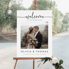 a welcome sign with an image of a couple on it