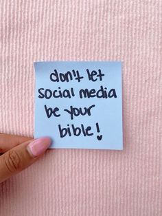 someone holding up a piece of paper that says don't let social media be your bible