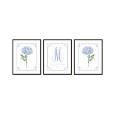 three blue flowers with the letter m on them are hanging in front of a white wall