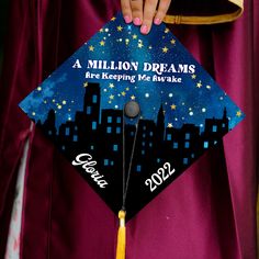 a person in a graduation cap that says, a million dreams are keeping me awake