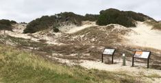 the sand dunes have signs on them to show where they are going and what they're doing