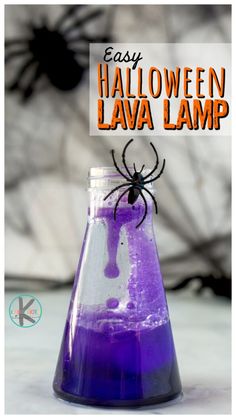 a purple liquid in a glass beakle with a spider on it and the words easy halloween lava lamp