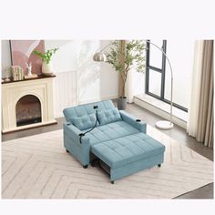 a blue couch sitting on top of a white rug