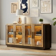 a wooden cabinet with glass doors in a living room