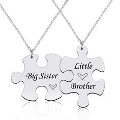 two pieces of puzzle necklaces with the words big sister and little brother on them