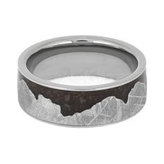 Say "I do" on your special day with this unique wavy mountain ring featuring real meteorite and fossilized dinosaur bone. The bold mountain design and ancient fossil inlay make this alternative wedding band a truly one-of-a-kind piece. You can even supply an image of your favorite mountain range to customize the shape of the meteorite mountains! RING LAYOUTRing Width: 8 mmRing Sleeve: TitaniumRing Profile: FlatRing Finish: Polished 0.5 mm Titanium3.5 mm Crushed Dinosaur Bone3.5 mm Gibeon Meteori Mountains Ring, Gibeon Meteorite, Alternative Wedding Bands, Mountain Ring, Mountain Design, Dinosaur Bones, Mountain Designs, Ring Sizer, Alternative Wedding