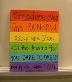 there is a sign that says somewhere over the rainbow skies are blue, and the dreams that you dare to dream really do come true