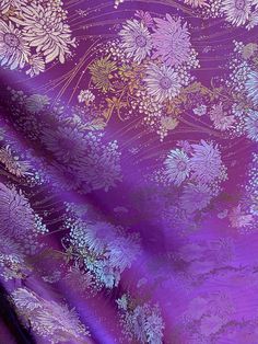 purple and gold fabric with flowers on it