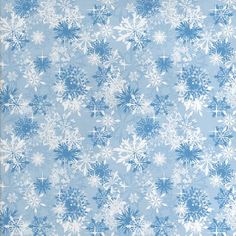 a blue and white snowflake pattern on a light blue background with a ruler in the foreground