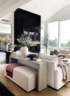 a living room filled with furniture and a flat screen tv mounted to the side of a wall