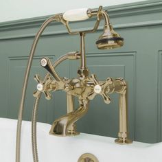 an old fashioned bathtub faucet with two handset