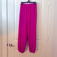 Zenana Women's Magenta Pink Split-Side Pants With Elastic Waist & Ankle Waist:S-13",M-14",L-15",Xl-16" Length:S-39",M-40",L-26.5",Xl-41" 57% Polyester 38% Rayon 5% Spandex Pink Stretch Wide Leg Parachute Pants, Stretch Pink Bottoms With Pull-on Style, Pink Stretch Parachute Pants With Elastic Waistband, Spring Harem Pants For Loungewear, Ankle-length, Spring Ankle-length Harem Pants For Loungewear, Fitted Ankle-length Bottoms With Elastic Waistband, Ankle-length Fitted Bottoms With Elastic Waistband, Pink Ankle-length Relaxed Fit Harem Pants, Pink Ankle-length Harem Pants With Relaxed Fit