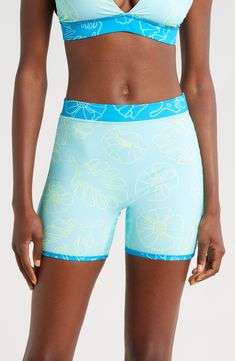 A reversible design doubles your styling opportunities in these effortless swim shorts made with built-in sun protection and a stretchy, stay-put fit. Elastic waist UPF 50+ sun protection 80% recycled polyester, 20% spandex Machine wash, tumble dry Imported Athleisure Swim Trunks With Built-in Shorts For Surfing, Warm Weather Swimwear With Built-in Shorts, Stretch Short Swimwear For Surfing, Sporty Swimwear With Built-in Shorts For Warm Weather, Summer Compression Athleisure Shorts, Summer Compression Shorts For Athleisure, Compression Shorts For Summer Athleisure, Athleisure Compression Shorts For Summer, Blue Moisture-wicking Biker Shorts For Summer