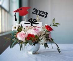 a vase filled with flowers on top of a table