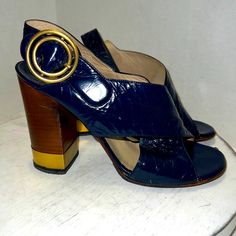 Chloe Patent Leather Blue Block Heel Sandal Gold Details Open Toe Womens Size 38.5 / 8.5 Made In Italy Gold Round Buckle Wooden Heel 3.5” Heel Excellent Preowned Condition - Please See All Pics For Details Feel Free To Ask Any Questions, Make An Offer Or Bundle For Additional Discount. I Ship Same Day Or Next Business Day. Smoke & Pet Free Home Thanks For Shopping! Designer Gucci Louis Vuitton Dior Celine Balenciaga Blue Block Heels, Chloe Shoes, Wooden Heel, Block Heels Sandal, Gold Details, Blue Gold, Patent Leather, Women's Shoes Sandals, Open Toe