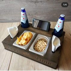 there is a tray with two bottles and some food on it