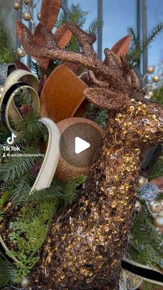 a christmas wreath with reindeer head and antlers