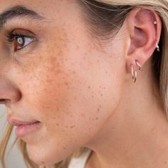 Introducing our 14k Little Diamond Bezel Studs. These studs are perfect for a subtle statement in your lobe or cartilage piercing. 14K Solid Gold and ethically-sourced Genuine Diamonds .10 CTW S12 Clarity, GH Color Available as a single or pair. Model wearing a single bezel stud in her cartilage. Minimalist 14k Gold Huggie Ear Climbers, Everyday Fine Jewelry Piercings, Hypoallergenic Yellow Gold Piercings, Everyday Hypoallergenic Yellow Gold Piercings, 14k Gold Ear Climbers For Everyday, Everyday Rose Gold 14k Gold Piercings, Minimalist Hypoallergenic Yellow Gold Ear Climbers, Dainty 14k Gold Ear Cuff For Everyday, Minimalist 14k Gold Hypoallergenic Ear Climbers